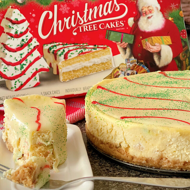 A cheesecake made stuffed with Little Debbie Christmas Tree Cakes.