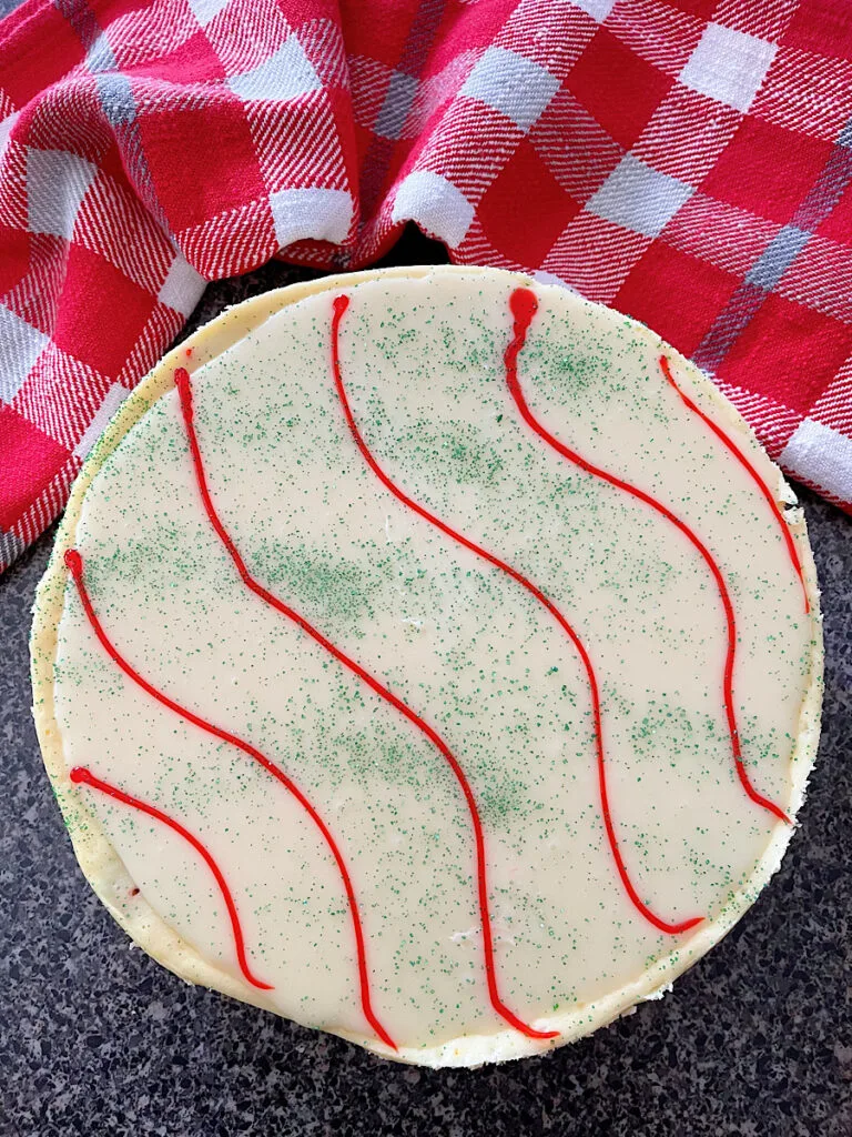 A decorated Little Debbie Christmas Tree Cake Cheesecake.