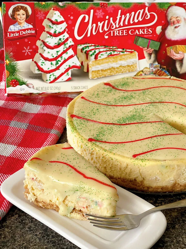 A slice of Little Debbie Christmas Tree Cake Cheesecake.