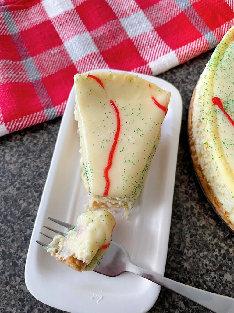 A slice of Little Debbie Christmas Tree Cake Cheesecake.