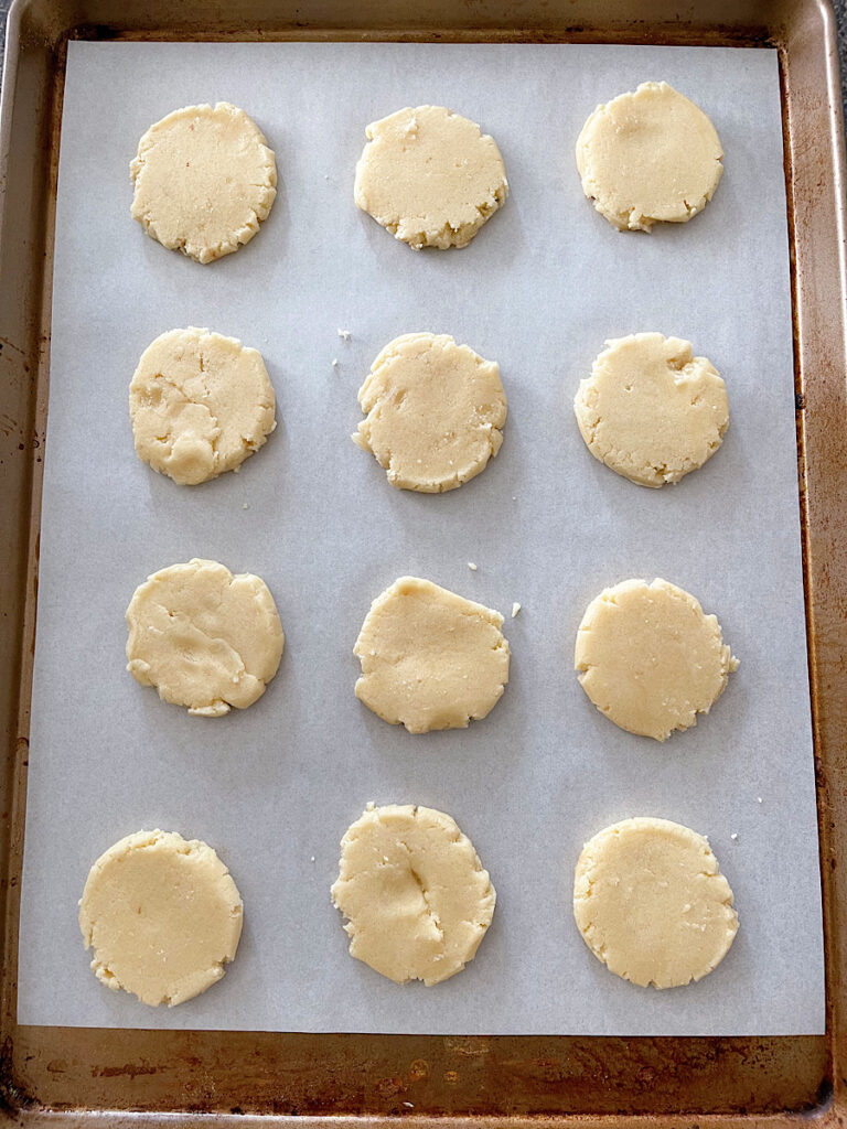 Vanilla sugar cookies on a baking sheet.