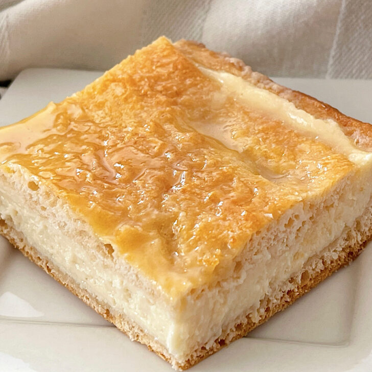 A slice of a cream cheese crescent roll breakfast danish.