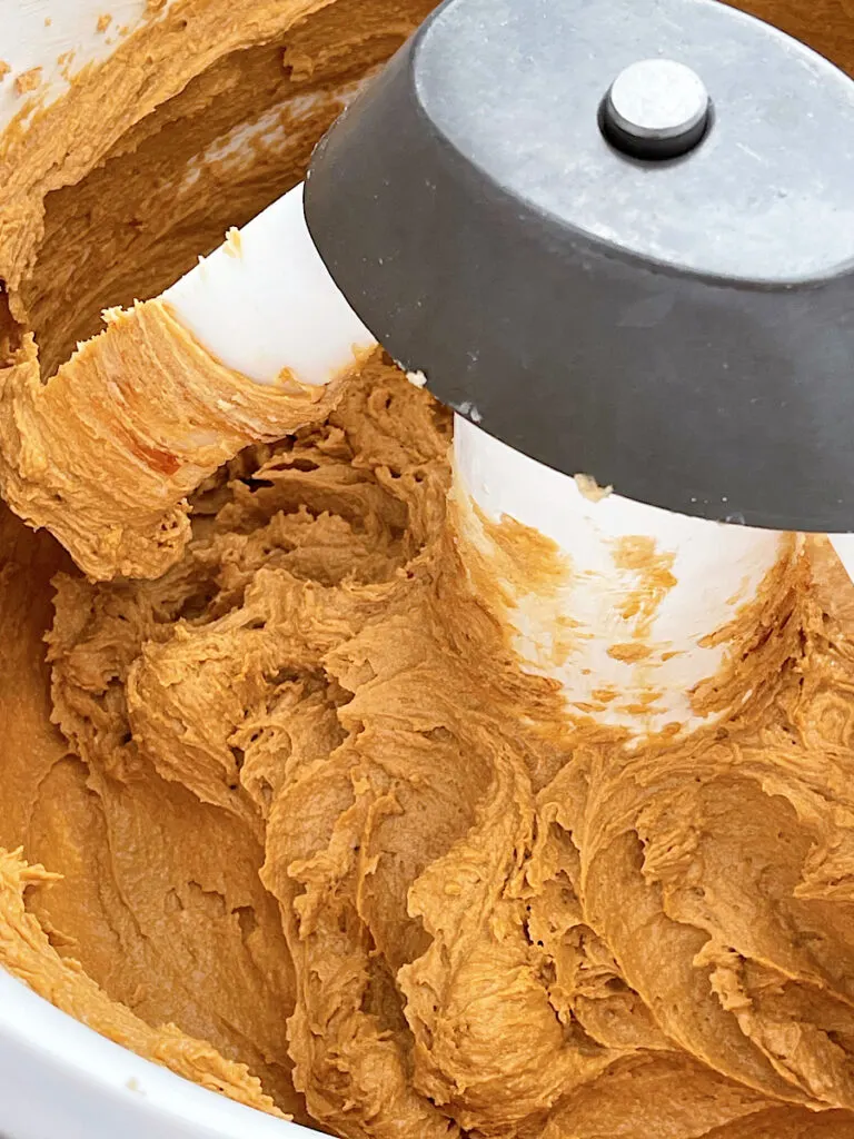 Butter, brown sugar, molasses, and vanilla mixed in the bowl of a stand mixer.