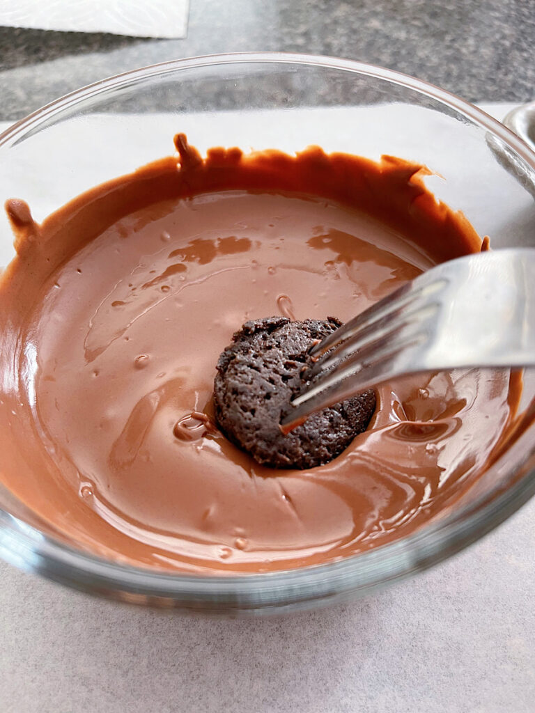 An OREO ball dipped in milk chocolate.
