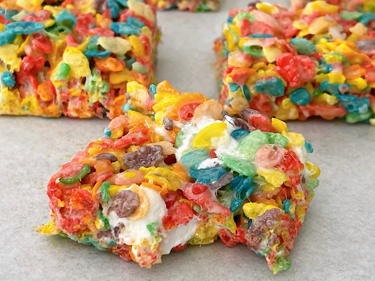 Fruity Pebbles Treats on parchment paper.