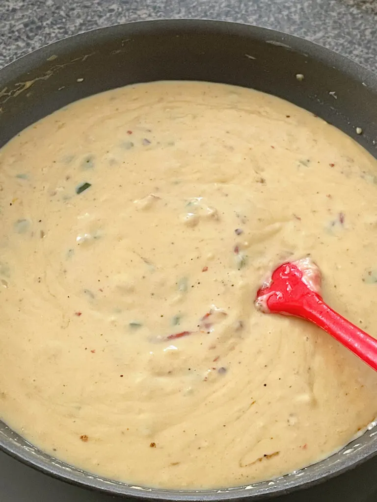 Copycat Chipotle queso blanco in a sauce pan.