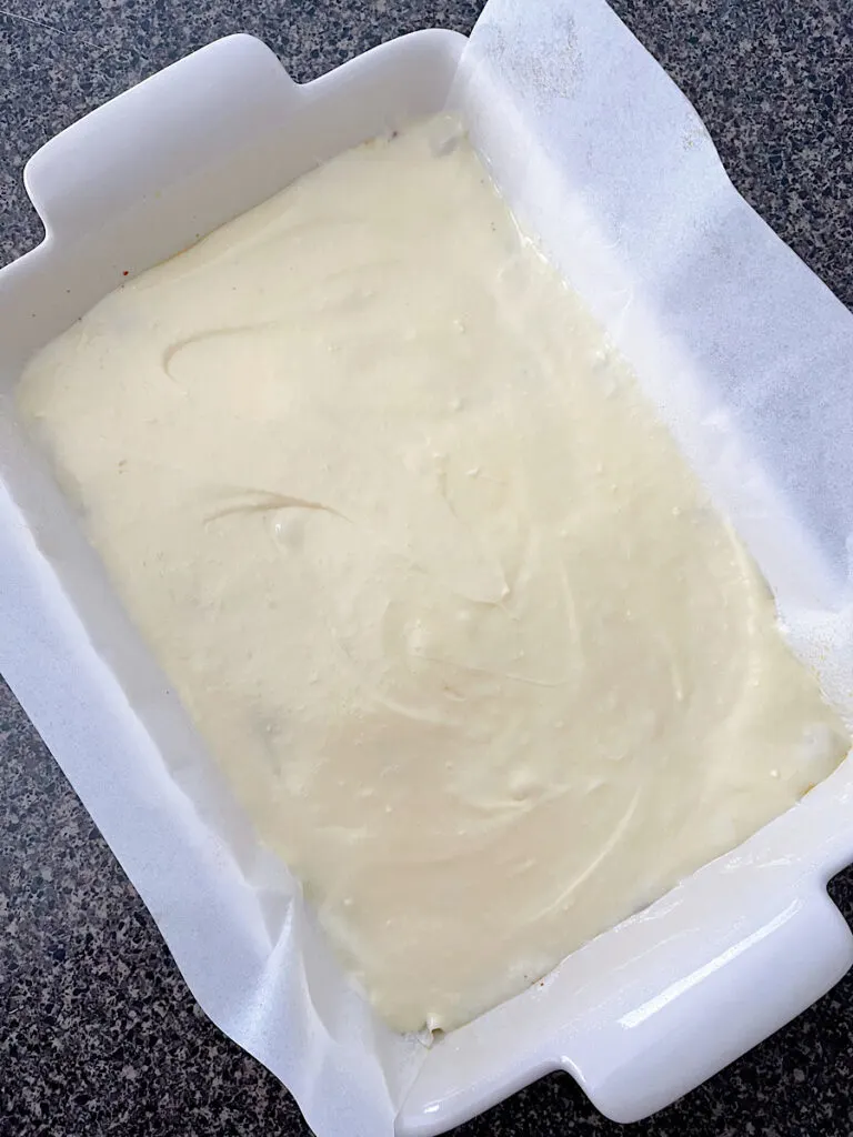 Cream cheese layer of ooey gooey bars.