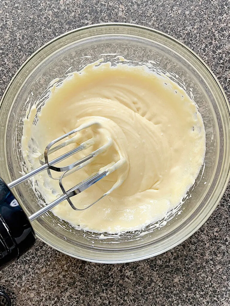 Cheesecake batter in a mixing bowl.