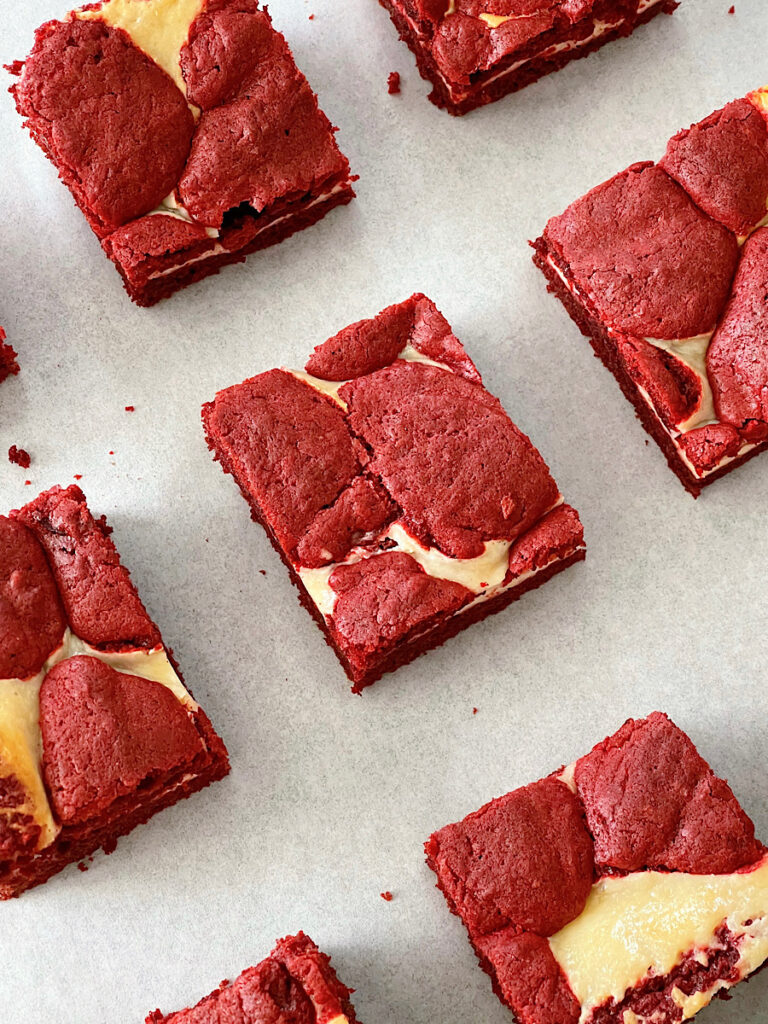 Cake mix red velvet brownies on parchment paper.