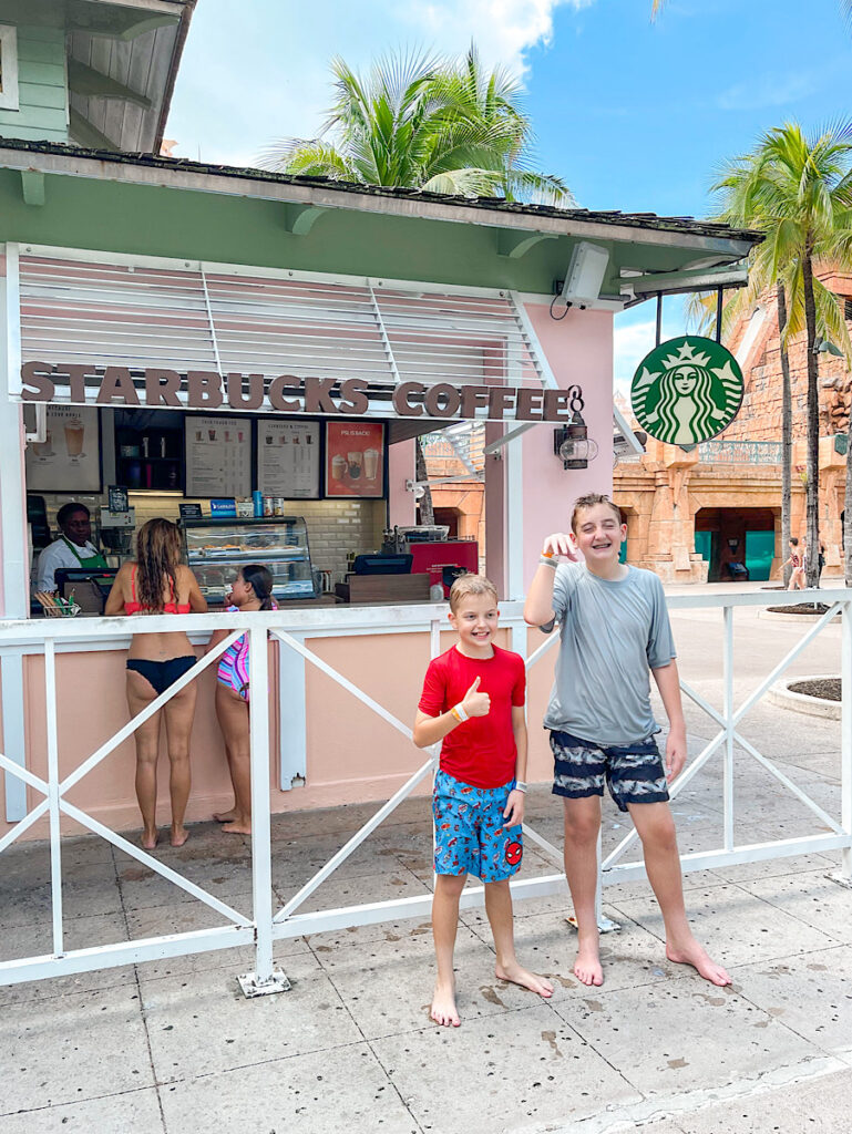 Two kids at Starbucks in Atlantis Aquaventure in the Bahamas.