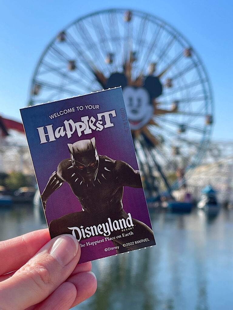 A Disneyland ticket in front of the Pixar-Pal-Around ferris wheel at Disneyland.
