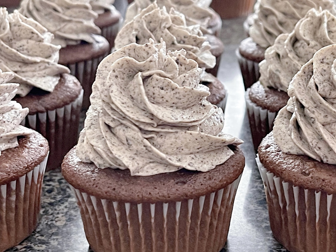 Oreo cupcakes filled with oreo cheesecake and topped with oreo frosting.