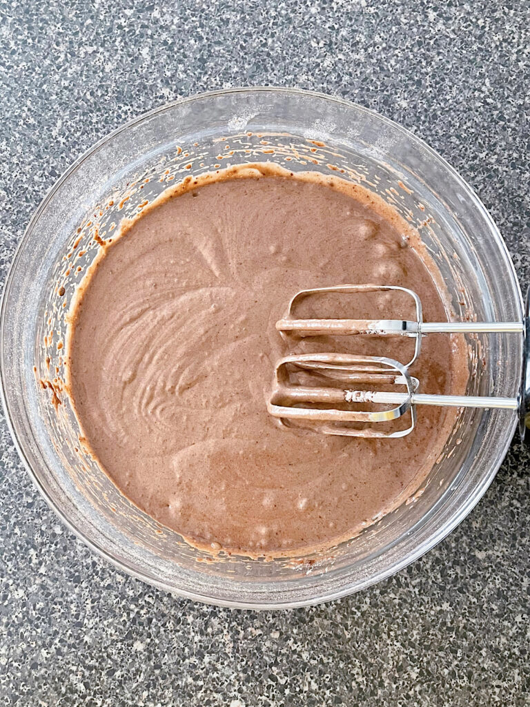 Chocolate cupcake batter in a mixing bowl.