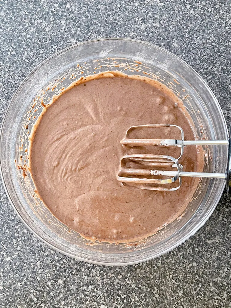Chocolate cupcake batter in a mixing bowl.