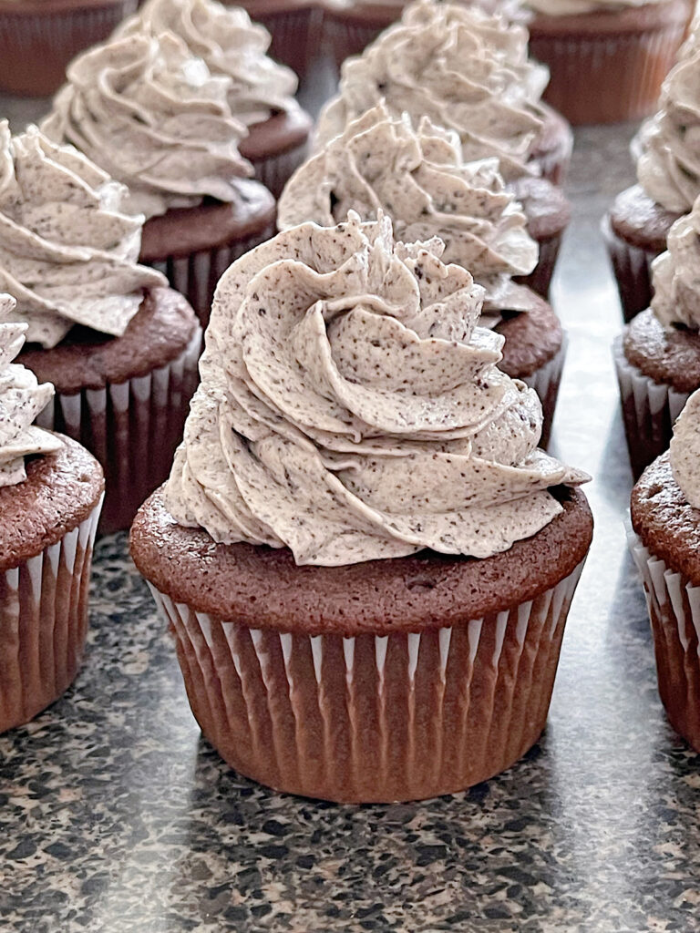 Oreo cupcakes filled with oreo cheesecake and topped with oreo frosting.