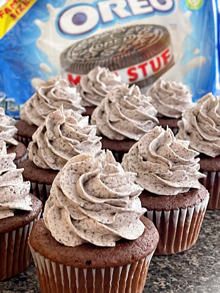 Oreo cupcakes filled with oreo cheesecake and topped with oreo frosting.