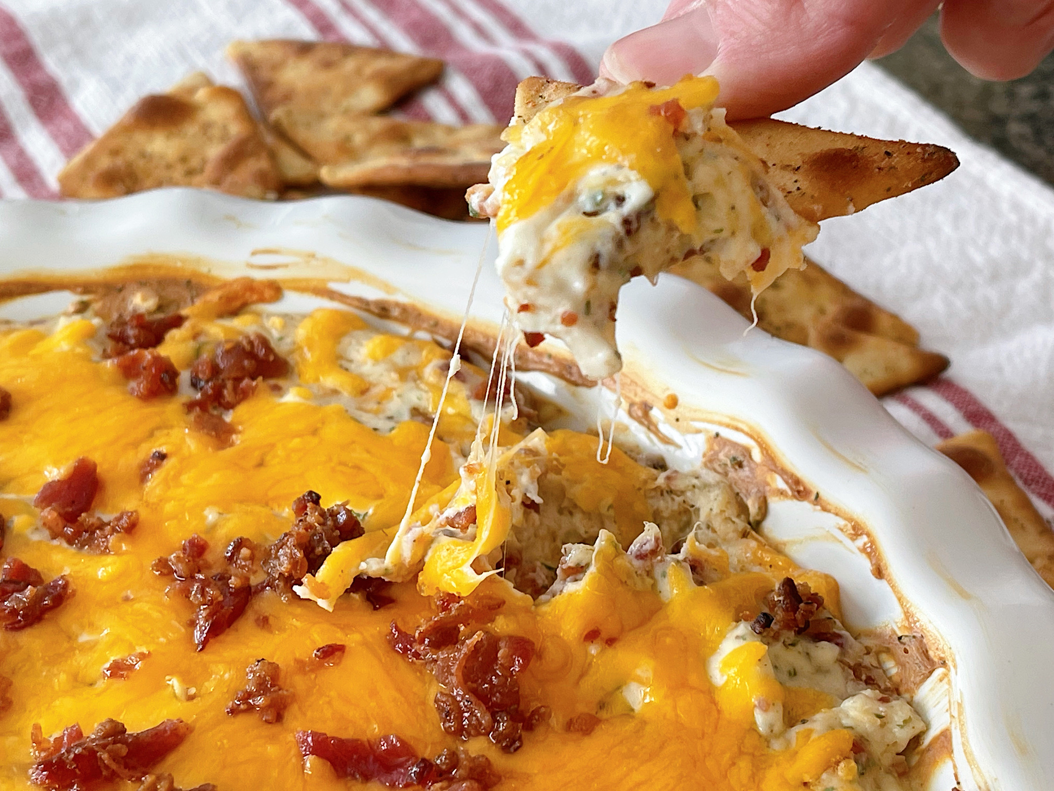 Crack chicken dip on a pita chip.