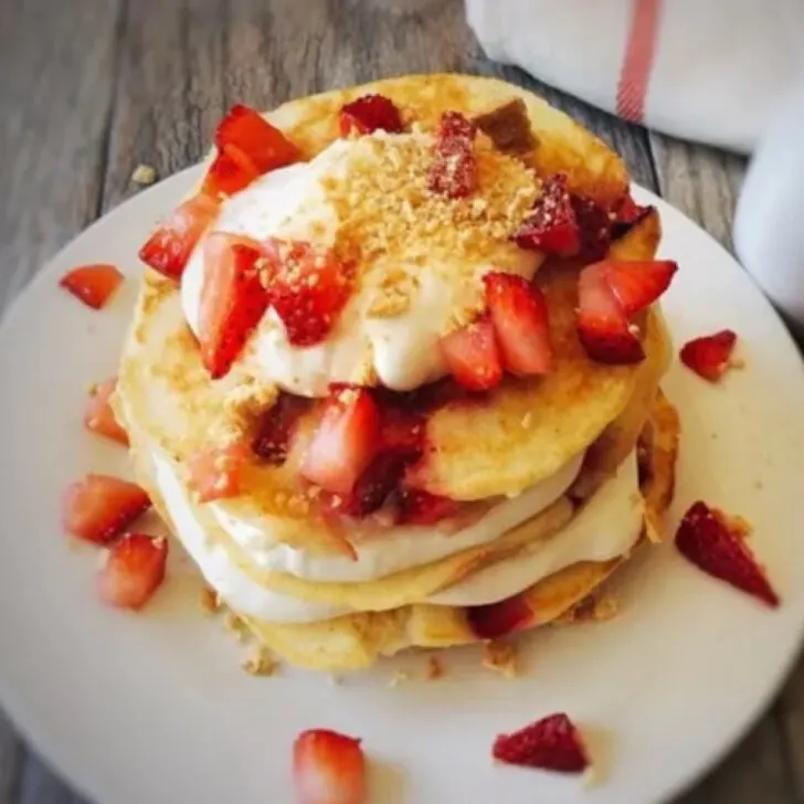 A stack of strawberry cheesecake pancakes.