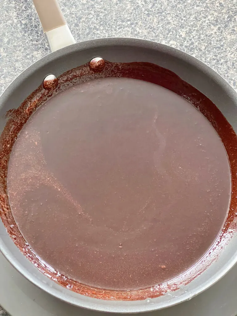 Melted butter and cocoa powder in a frying pan.