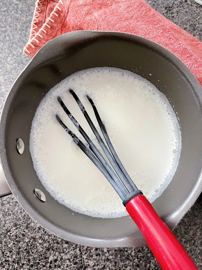 Warm milk in a saucepan.