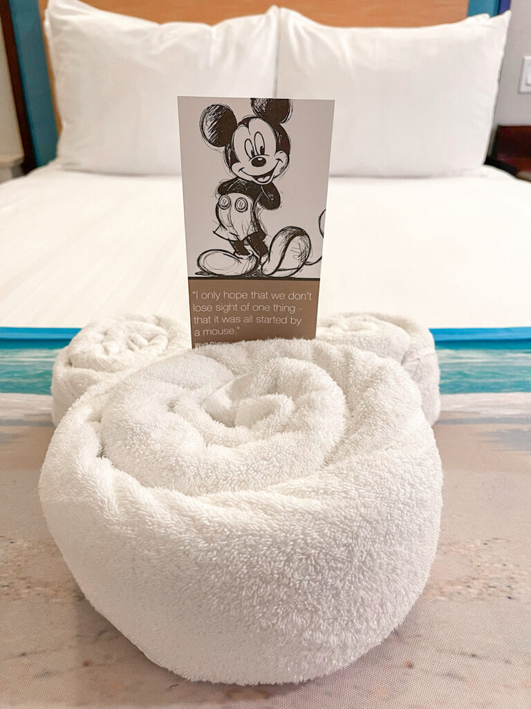Mickey Mouse towel on a bed in the Newport Suite.