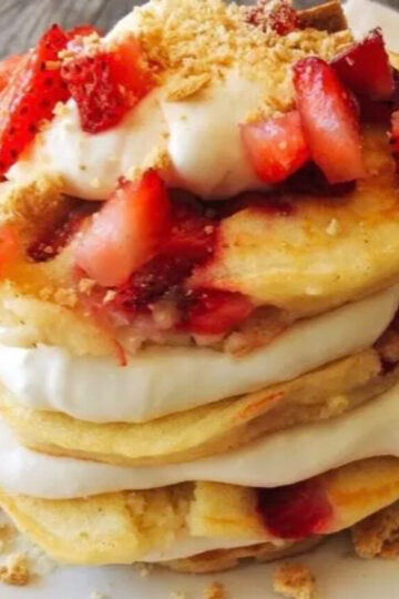 A stack of strawberry cheesecake pancakes.