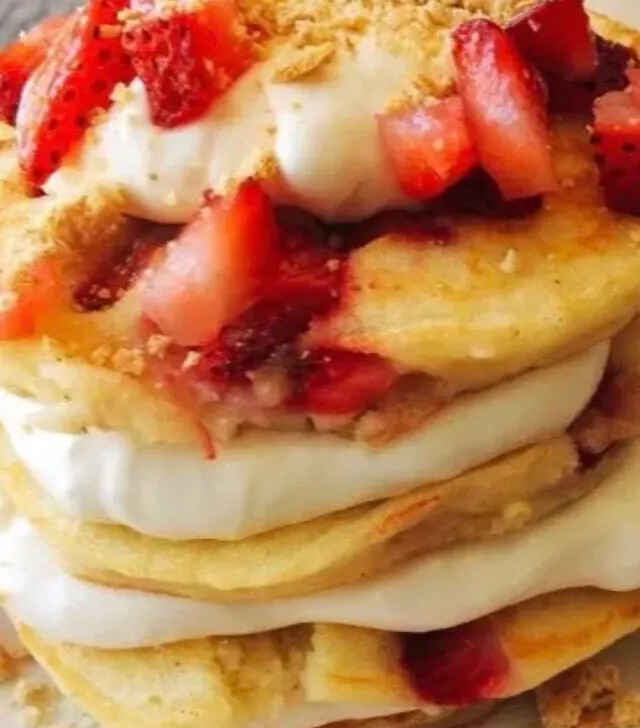 A stack of strawberry cheesecake pancakes.