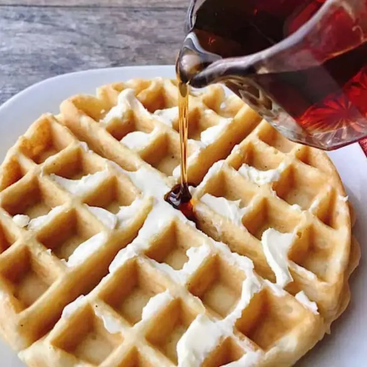 Syrup poured on a waffle.