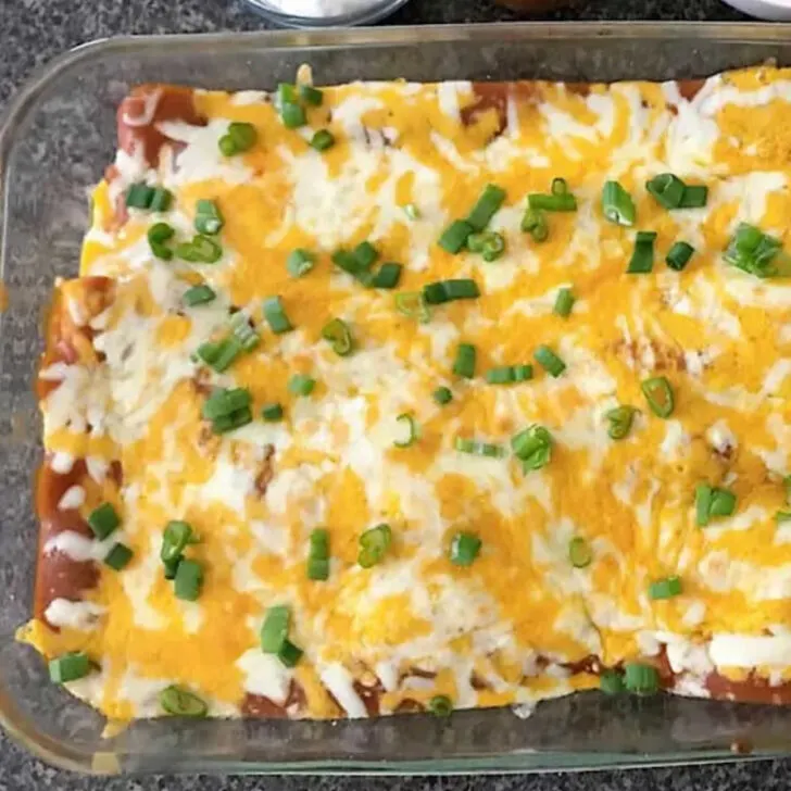 A pan of baked restaurant style cheese enchiladas