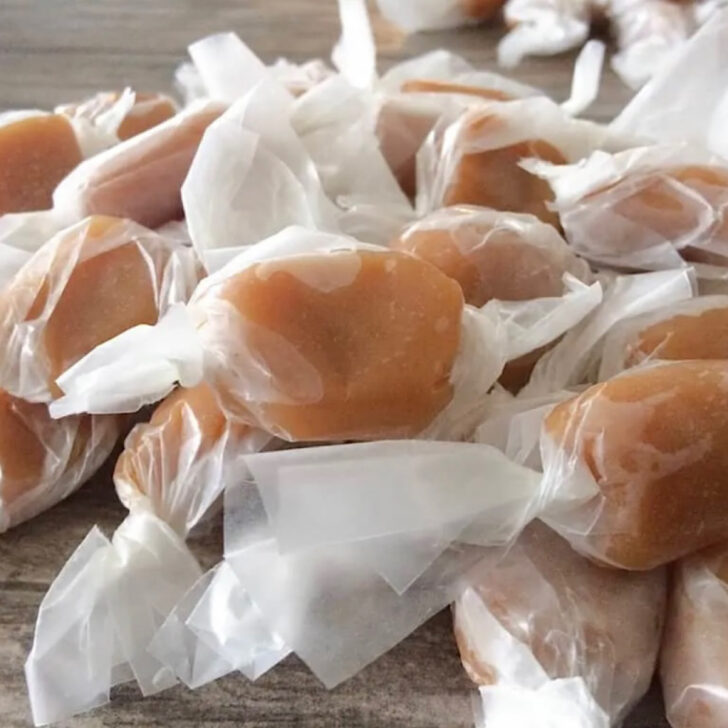 Homemade microwave caramels wrapped in wax paper.