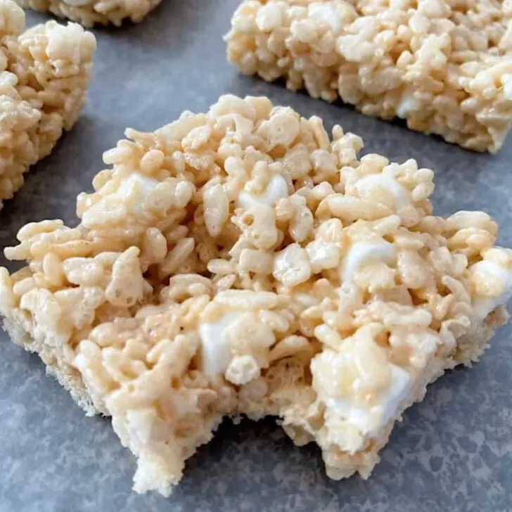 A rice krispie treat with a bite taken out.
