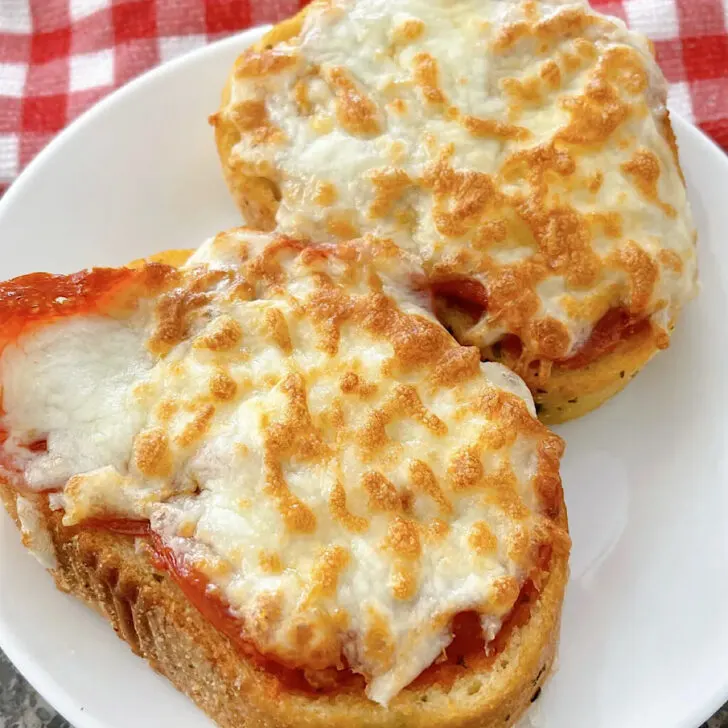 Two slices or air fryer garlic bread pizza.