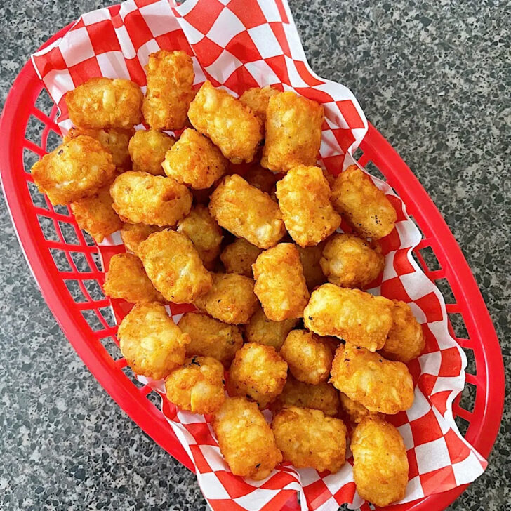 Tater tots in a red basket.
