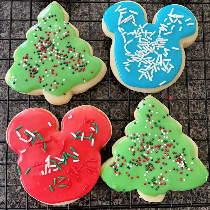 Four Christmas sugar cookies decorated with icing that hardens.