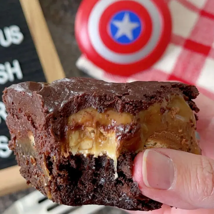 A Snickers brownie with a bite taken out.