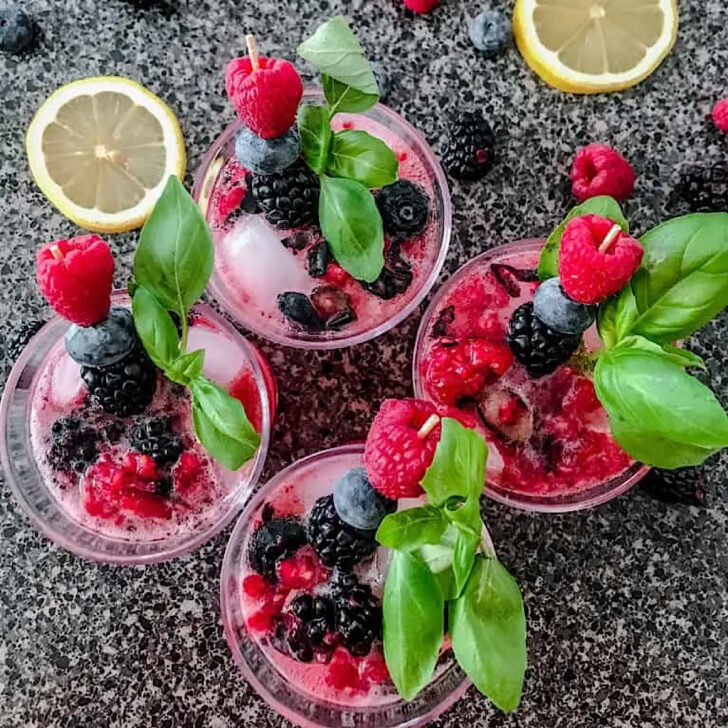 Four glasses of berry lemonade.