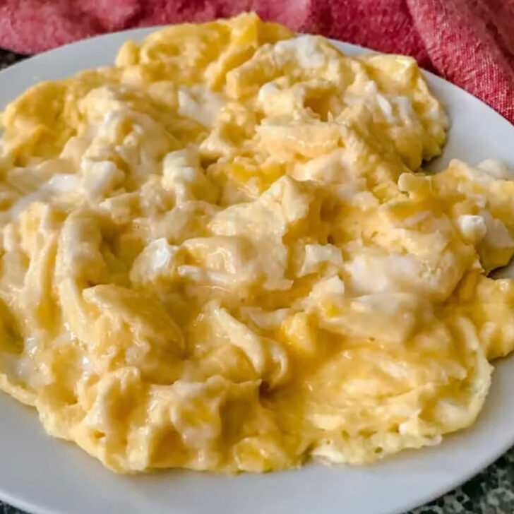 A plate of scrambled eggs.