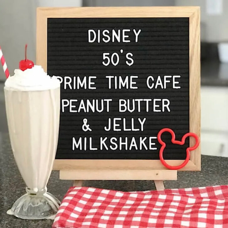 A peanut butter and jelly milkshake next to a sign that says, 