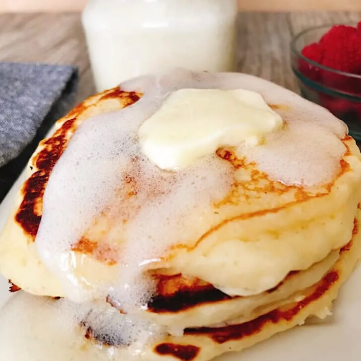Fluffy buttermilk pancakes with buttermilk syrup.