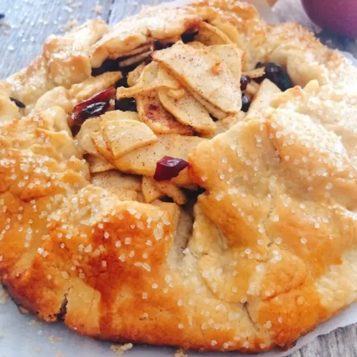 An apple pie gallete with dried cranberries.