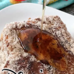 Syrup poured over Disney's Tonga Toast, French toast stuffed with bananas and covered in cinnamon sugar.