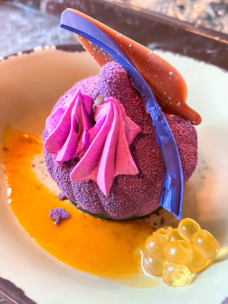 Metkayina Mousse: Flourless Chocolate Cake, Chocolate Mousse, Raspberry Gelée, Mango Coulis, Boba Pearls, and a Milk and White Chocolate Garnish from Satu'li Canteen at Disney's Animal Kingdom.