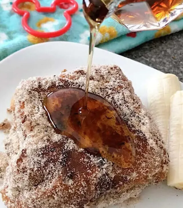 Syrup poured over Disney's Tonga Toast, French toast stuffed with bananas and covered in cinnamon sugar.