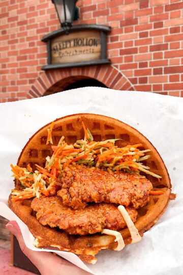 A Spicy Chicken Waffle Sandwich from Sleepy Hollow at Disney World.