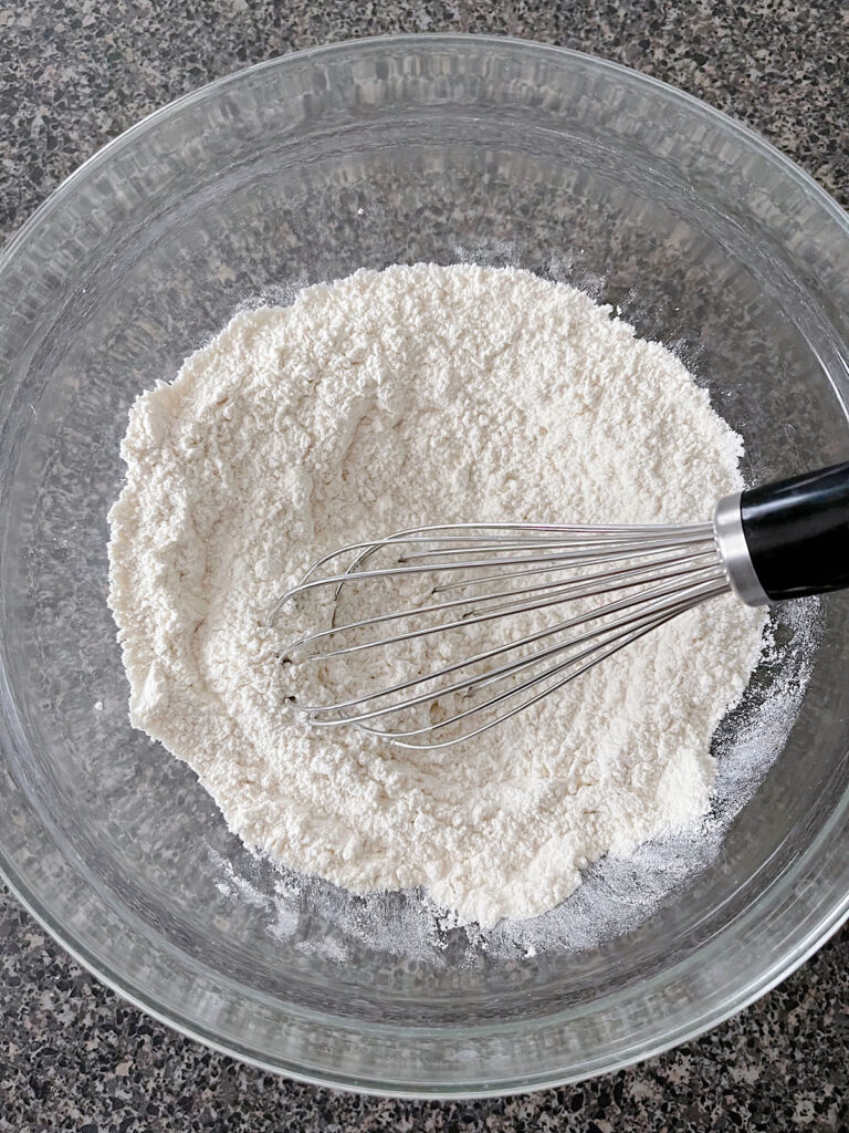 A bowl of dry ingredients for vanilla cupcakes.