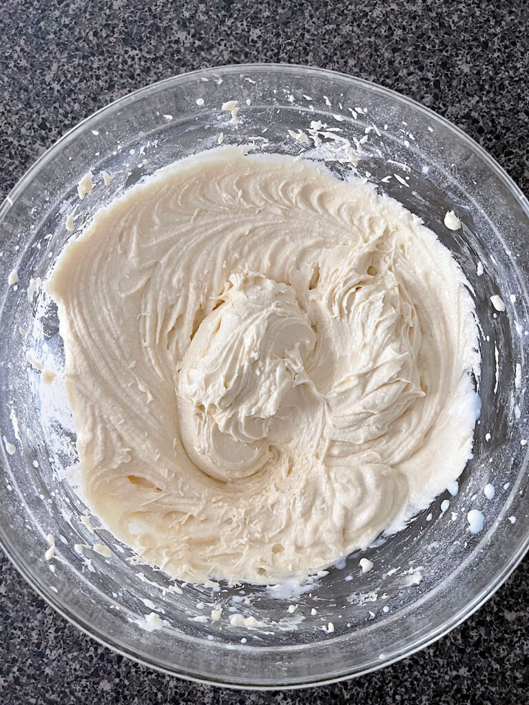Vanilla cupcake batter in a mixing bowl.
