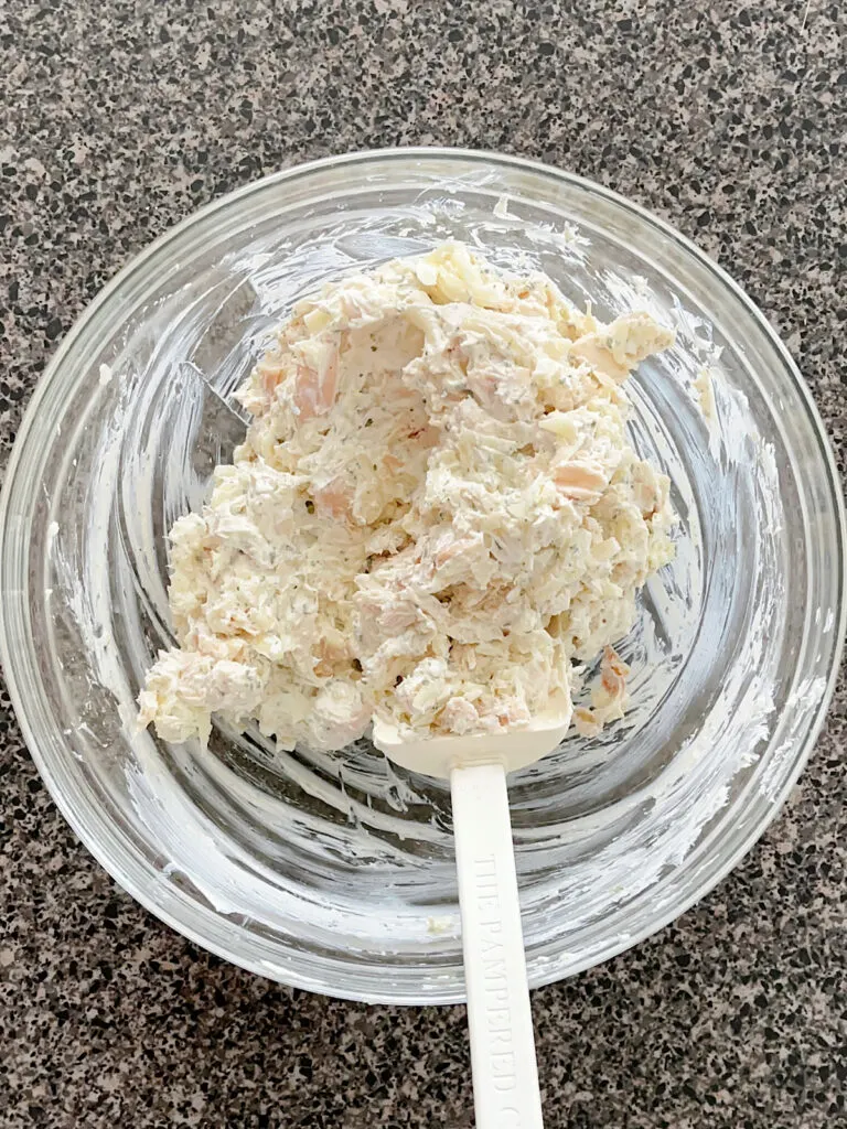 Chicken and cream cheese filling in a bowl.