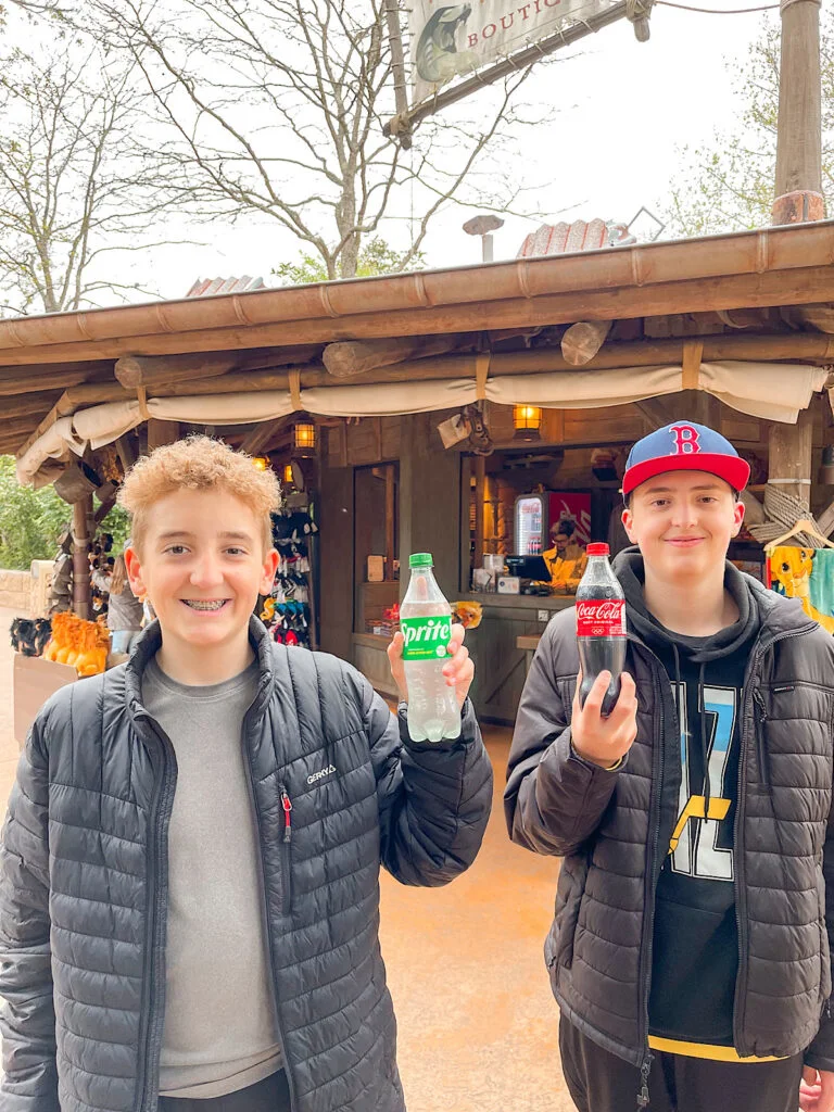 Two kids with soda at Disneyland Paris.