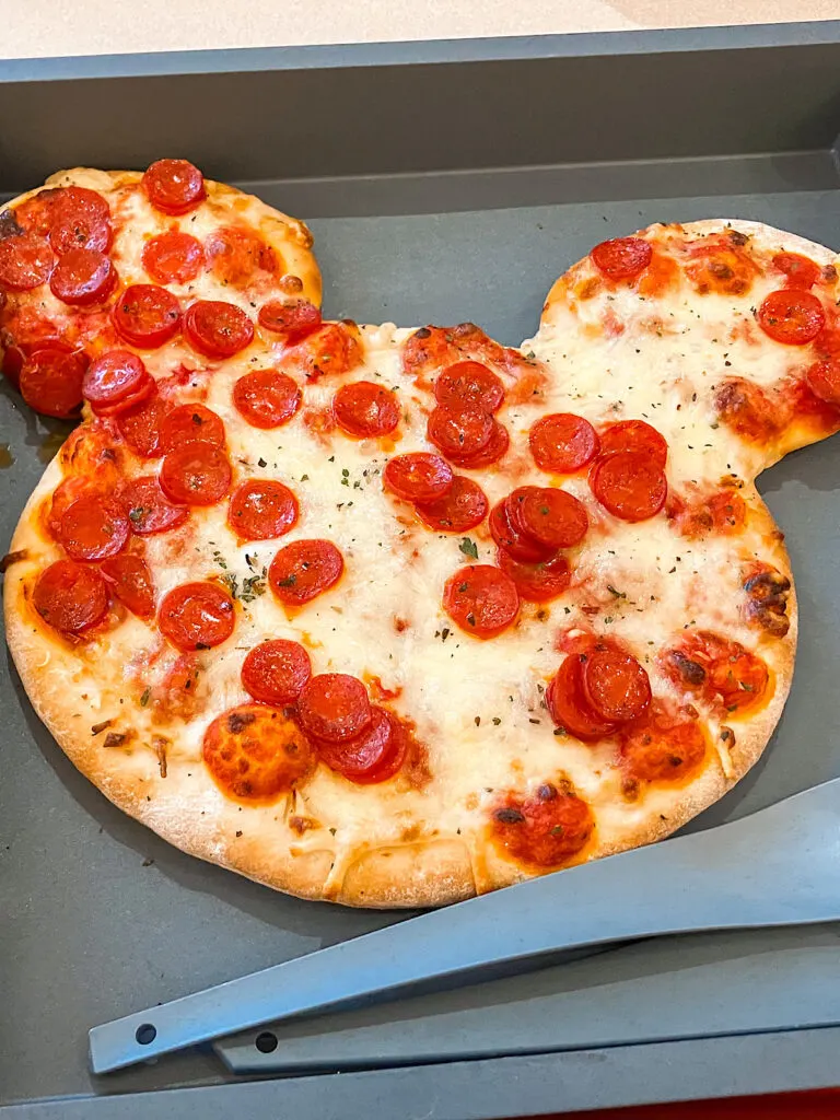 A Mickey Mouse-shaped pizza from Disney Village.