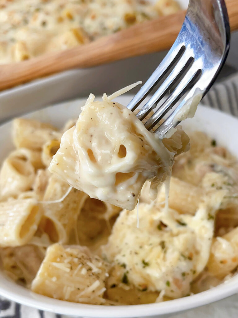 Garlic Parmesan Chicken Alfredo on a fork.